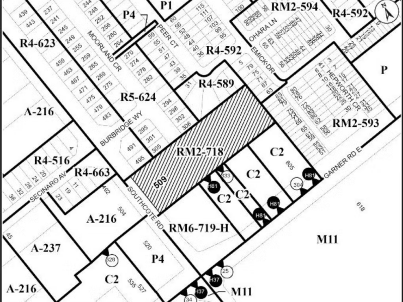 A high-contrast, black-and-white planning map outlines municipal property boundaries and zoning codes in Ancaster. The subject parcel at 509 Southcote Road is filled with diagonal hatching lines and labelled RM2-718. The map shows adjacent residential zoning categories, including R4, R5, and RM2 designations along Burbridge Way and Hepworth Crescent, alongside commercial C2 zones and industrial M11 zones along Garner Road East under flat digital schematic illumination.